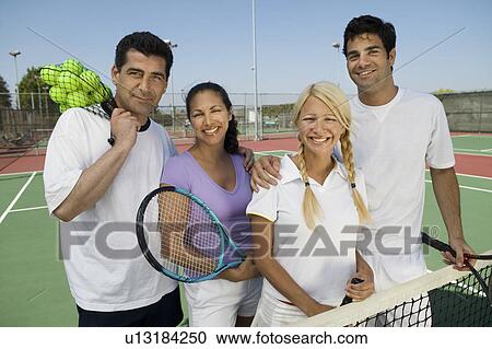 Four mixed doubles tennis players at net on tennis court portrait View Large Photo Image Stock Image - Four mixed doubles tennis players at net on tennis court portrait. Fotosearch