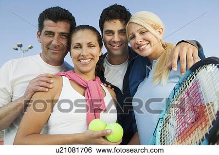 Four mixed doubles tennis players by net at tennis court portrait View Large Photo Image Stock Photograph - Four mixed doubles tennis players by net at tennis court portrait. Fotosearch