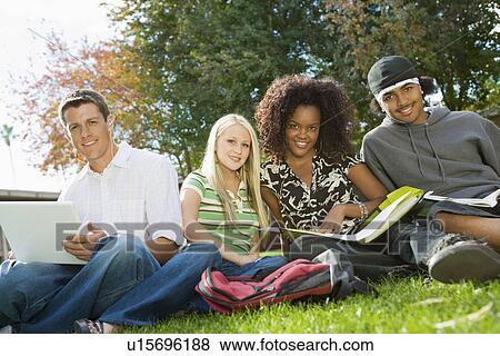 Four students studying outdoors (portrait) View Large Photo Image Stock Photo - Four students studying outdoors (portrait). Fotosearch