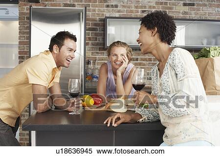 Stock Photography - Friends in Kitchen. Fotosearch