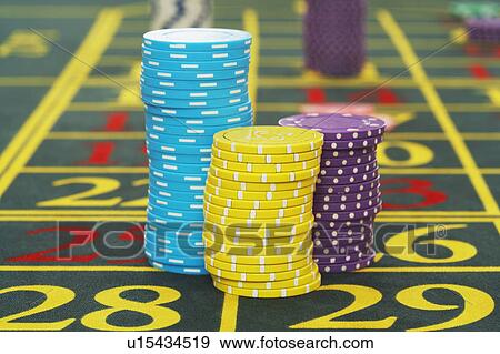 Gambling Chips on Roulette Table close up View Large Photo Image Stock Photo - Gambling Chips on Roulette Table close up. Fotosearch