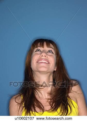 Girl in studio looking up head and shoulders View Large Photo Image Stock Photo - Girl in studio looking up head and shoulders. Fotosearch