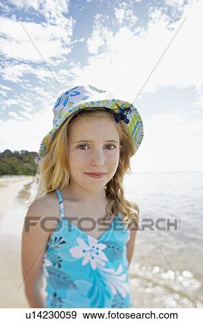 Girl standing on beach portrait View Large Photo Image Stock Photo - Girl standing on beach portrait. Fotosearch