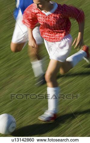 Girls (13-17) playing soccer elevated view View Large Photo Image Stock Image - Girls (13-17) playing soccer elevated view. Fotosearch