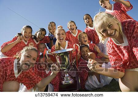 Girls' soccer team (13-17) holding trophy View Large Photo Image Picture - Girls' soccer team (13-17) holding trophy. Fotosearch