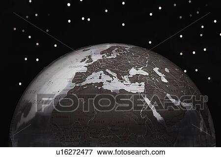 Stock Photo - Globe against starry sky cropped. Fotosearch