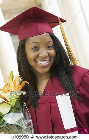 Graduate Holding Flowers and Diploma portrait View Large Photo Image Picture - Graduate Holding Flowers and Diploma portrait. Fotosearch