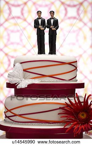 Stock Image - Groom Figurines on Wedding Cake. Fotosearch
