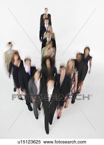Group of Businesspeople in arrow formation blurred effect View Large Photo Image Stock Photography - Group of Businesspeople in arrow formation blurred effect. Fotosearch