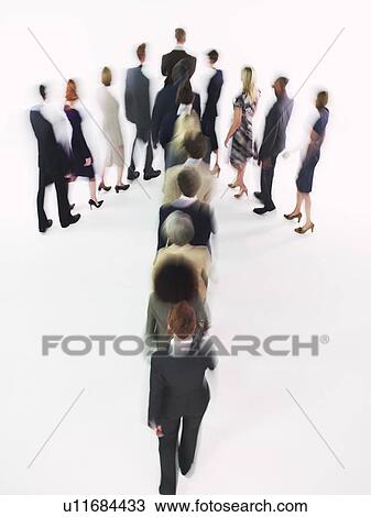Group of Businesspeople walking in arrow formation View Large Photo Image Stock Image - Group of Businesspeople walking in arrow formation. Fotosearch