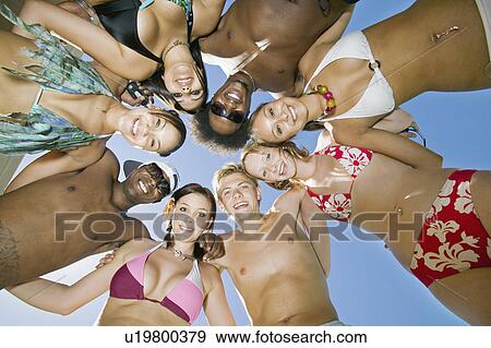Group of friends in circle view from below portrait View Large Photo Image Stock Photo - Group of friends in circle view from below portrait. Fotosearch