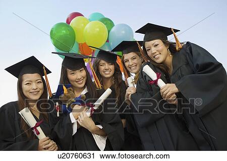 Group of graduates with diplomas and balloons outside portrait View Large Photo Image Stock Image - Group of graduates with diplomas and balloons outside portrait. Fotosearch