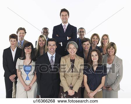 Group of smiling businesspeople man standing taller View Large Photo Image Stock Photo - Group of smiling businesspeople man standing taller. Fotosearch