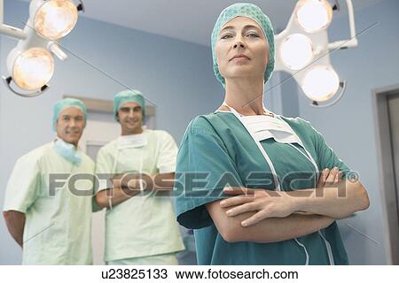 Head of Surgical Team with surgeons in operating theatre portrait View Large Photo Image Stock Image - Head of Surgical Team with surgeons in operating theatre portrait. Fotosearch
