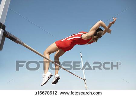 High Jumper in mid air over bar view from below View Large Photo Image Stock Image - High Jumper in mid air over bar view from below. Fotosearch