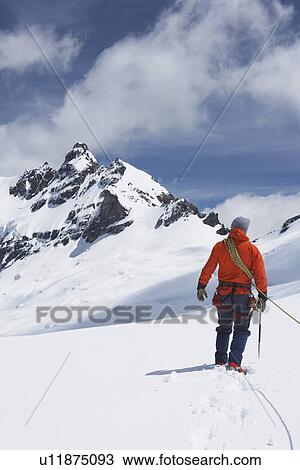 Hiker connected to safety line in snowy mountains back view View Large Photo Image Stock Image - Hiker connected to safety line in snowy mountains back view. Fotosearch