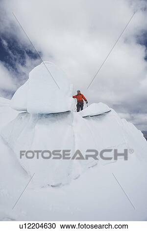 Hiker standing on top ice formation View Large Photo Image Stock Image - Hiker standing on top ice formation. Fotosearch
