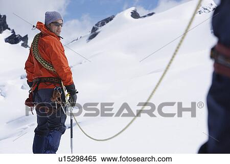 Hikers joined by safety line in snowy mountains View Large Photo Image Stock Photography - Hikers joined by safety line in snowy mountains. Fotosearch