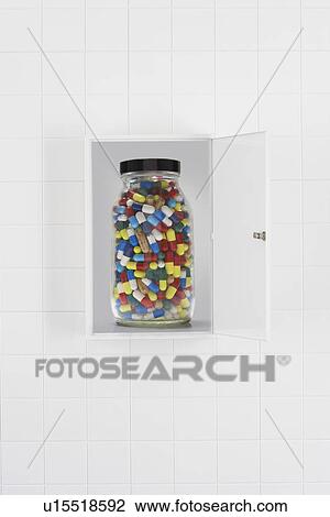 Jar of pills in bathroom cabinet View Large Photo Image Stock Image - Jar of pills in bathroom cabinet. Fotosearch