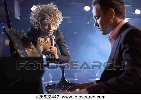 Jazz singer and pianist on stage View Large Photo Image Stock Photo - Jazz singer and pianist on stage. Fotosearch
