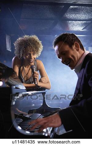 Jazz Singer and Pianist Performing View Large Photo Image Stock Photography - Jazz Singer and Pianist Performing. Fotosearch