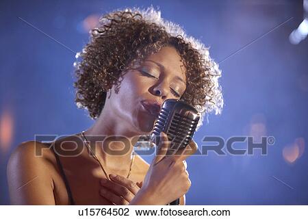 Jazz singer on stage portrait View Large Photo Image Stock Image - Jazz singer on stage portrait. Fotosearch