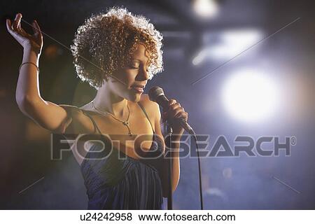 Stock Photo - Jazz singer on stage portrait. Fotosearch