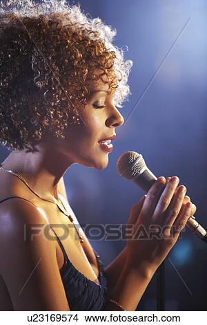 Picture - Jazz singer on stage profile. Fotosearch