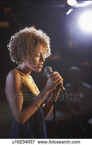 Jazz singer on stage profile View Large Photo Image Stock Photo - Jazz singer on stage profile. Fotosearch