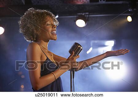 Jazz singer on stage side view View Large Photo Image Stock Image - Jazz singer on stage side view. Fotosearch