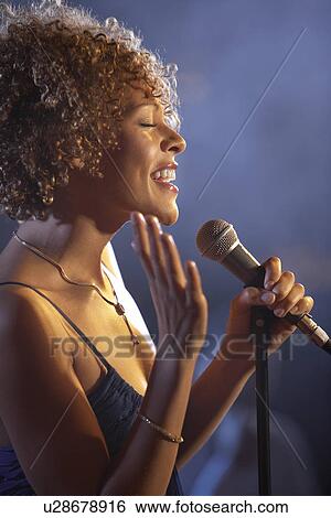 Jazz singer on stage side view View Large Photo Image Stock Photograph - Jazz singer on stage side view. Fotosearch