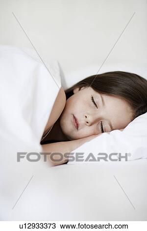 Little Girl Sleeping in bed close up View Large Photo Image Stock Image - Little Girl Sleeping in bed close up. Fotosearch