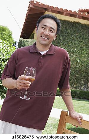 Man drinking wine in garden View Large Photo Image Stock Photography - Man drinking wine in garden. Fotosearch
