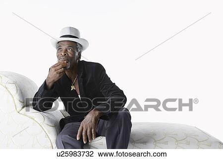 Man in Fedora on Chaise Lounge View Large Photo Image Stock Image - Man in Fedora on Chaise Lounge. Fotosearch