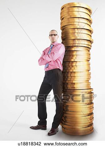 Man in glasses leaning against pile of coins digital composite View Large Photo Image Stock Image - Man in glasses leaning against pile of coins digital composite. Fotosearch