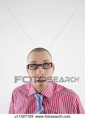 Man in glasses looking up head and shoulders View Large Photo Image Stock Image - Man in glasses looking up head and shoulders. Fotosearch