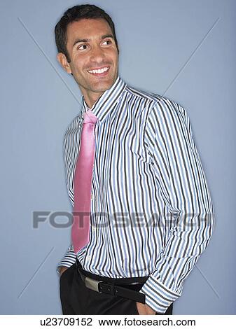 Stock Image - Man in shirt and tie smiling half length. Fotosearch