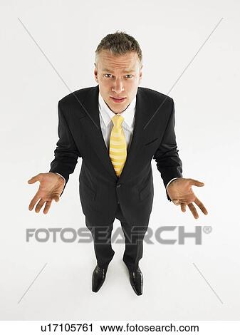 Man in suit with palms raised full length View Large Photo Image Stock Image - Man in suit with palms raised full length. Fotosearch