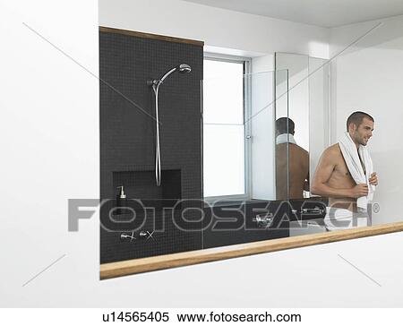 Man leaning against sink in bathroom View Large Photo Image Stock Photography - Man leaning against sink in bathroom. Fotosearch