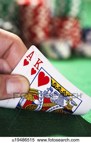 Man peeked at two cards close up of hand View Large Photo Image Stock Photography - Man peeked at two cards close up of hand. Fotosearch