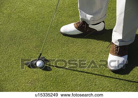 Man putting green (low section) View Large Photo Image Stock Photo - Man putting green (low section). Fotosearch