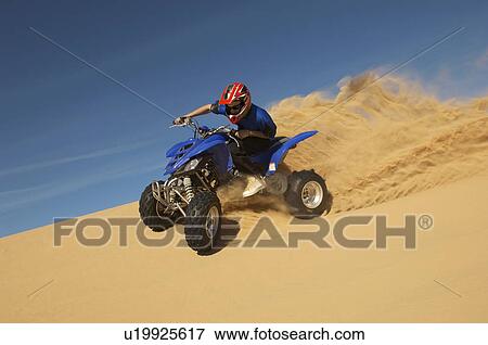 Man riding quad bike in desert View Large Photo Image Stock Photo - Man riding quad bike in desert. Fotosearch