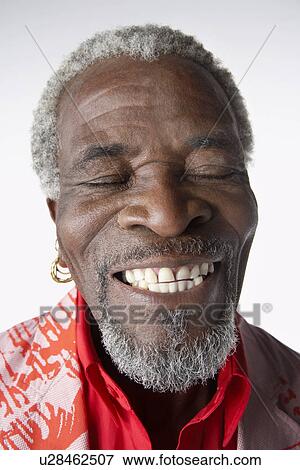 Stock Photo - Man Smiling eyes closed. Fotosearch