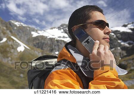 Man using walkie-talkie in mountains View Large Photo Image Stock Photograph - Man using walkie-talkie in mountains. Fotosearch