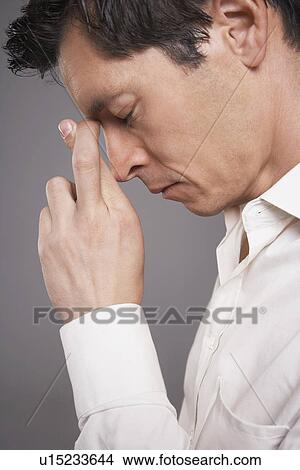 Man with fingers crossed close-up profile View Large Photo Image Picture - Man with fingers crossed close-up profile. Fotosearch