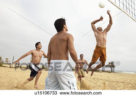 Men Playing Volleyball on beach View Large Photo Image Stock Image - Men Playing Volleyball on beach. Fotosearch