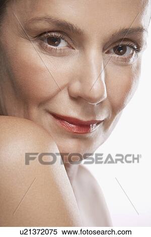 Middle-Aged Woman looking over shoulder View Large Photo Image Stock Photography - Middle-Aged Woman looking over shoulder. Fotosearch