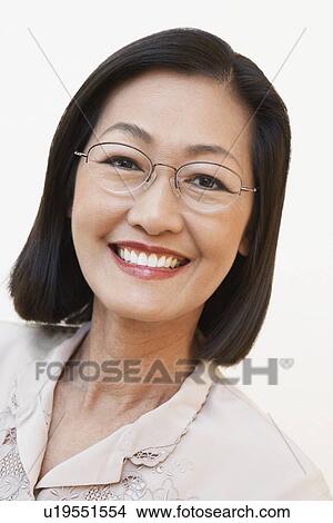 Picture - Middle aged woman wearing glasses portrait (portrait). Fotosearch