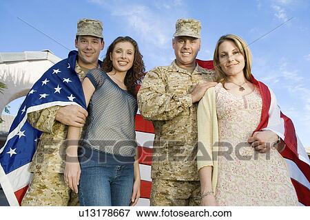 Military couples embracing outdoors (portrait) View Large Photo Image Stock Photo - Military couples embracing outdoors (portrait). Fotosearch
