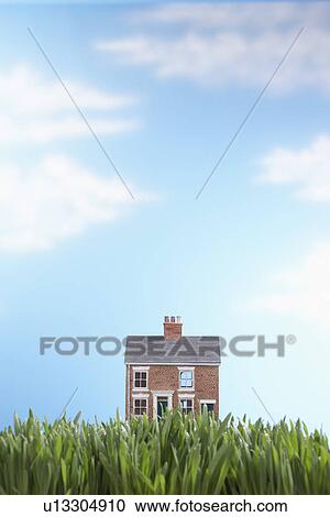Model house in grass View Large Photo Image Stock Image - Model house in grass. Fotosearch